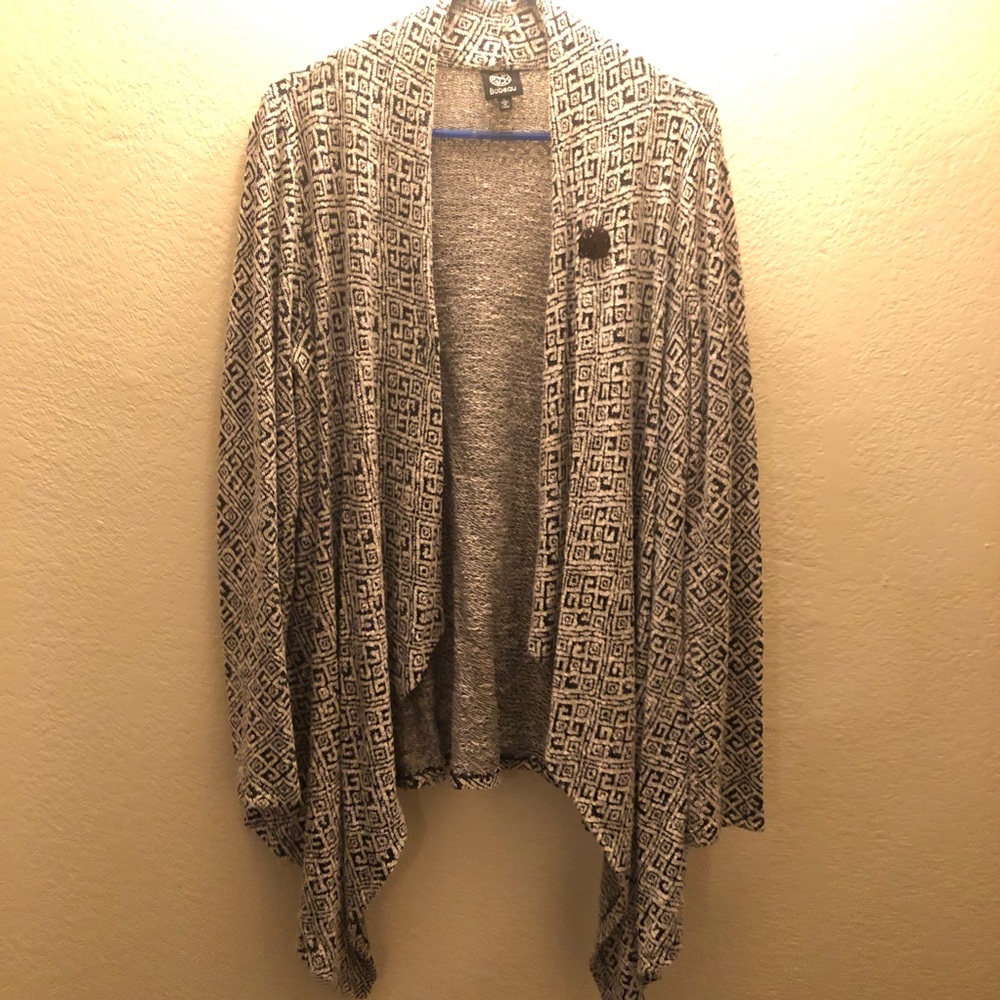 Long sleeve cream and black sweater.